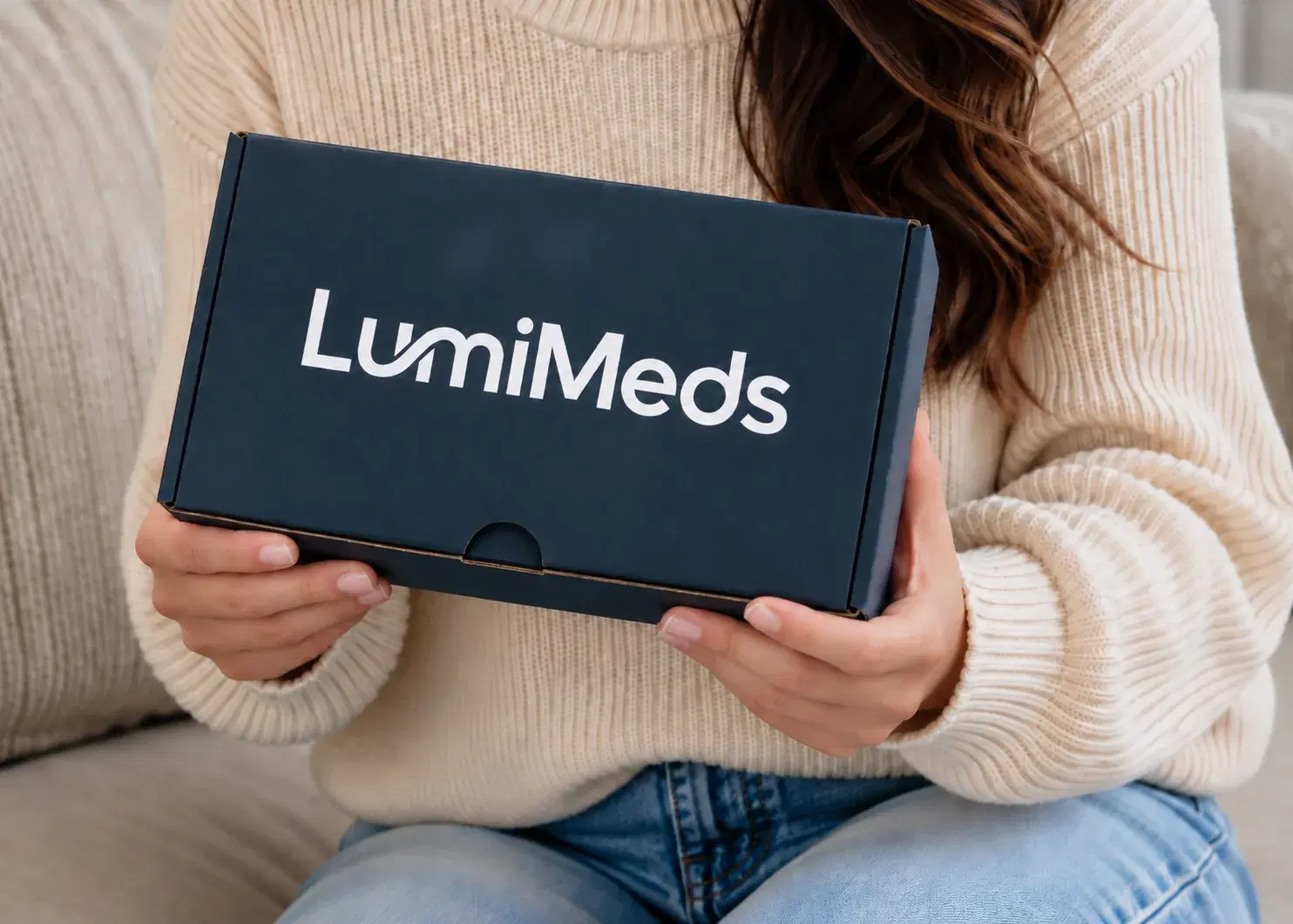Patient holding a LumiMeds shipping box