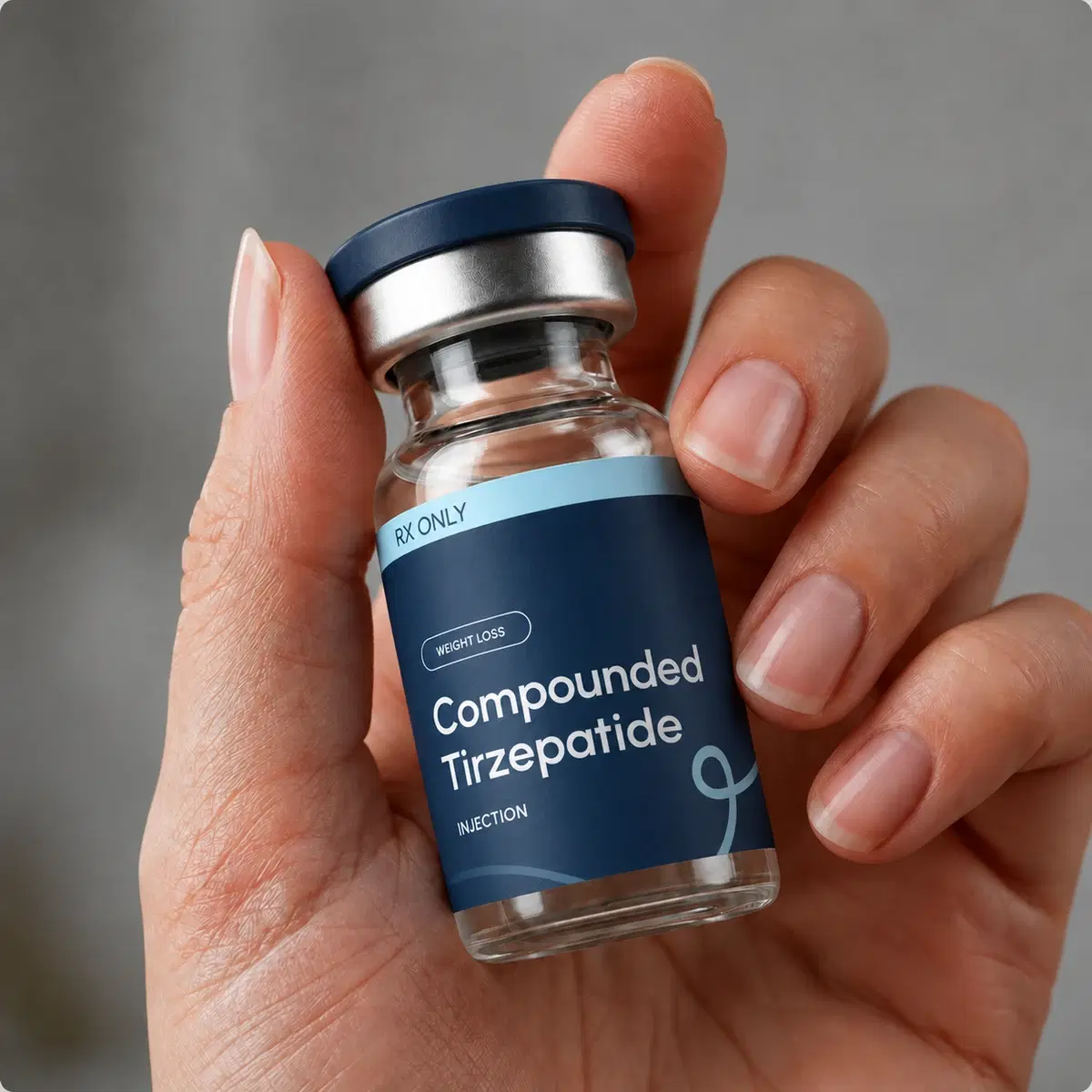 Hand holding a LumiMeds compounded Tirzepatide vial