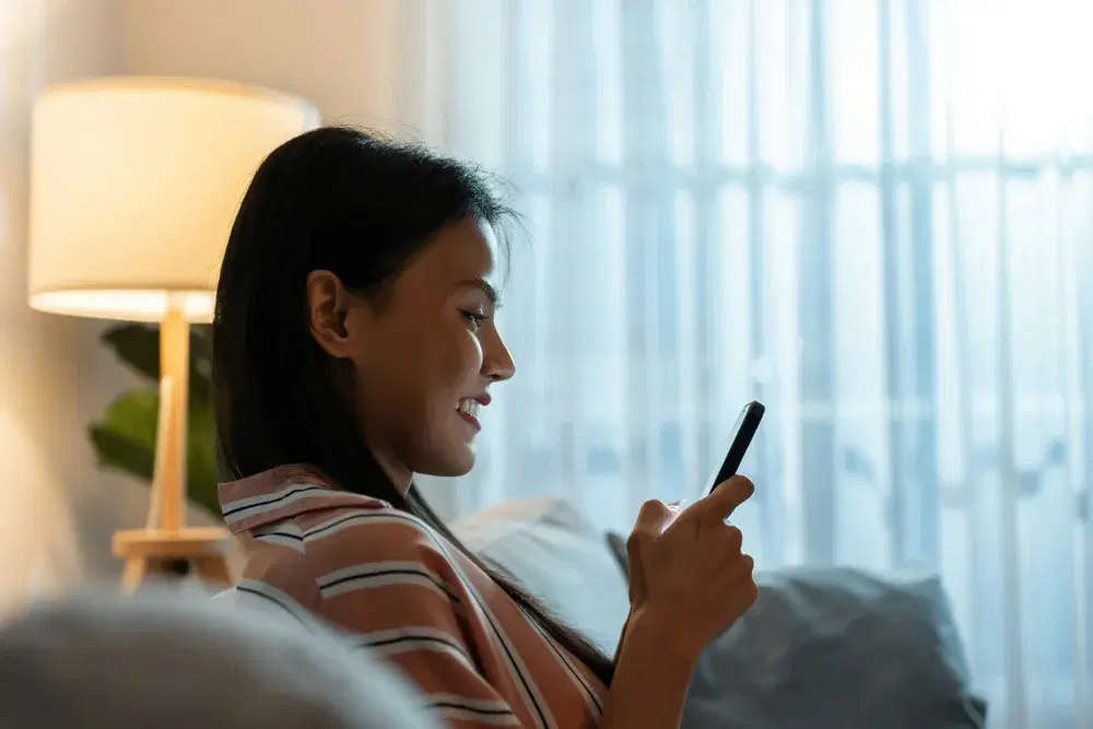 Patient completing the LumiMeds health assessment on her phone